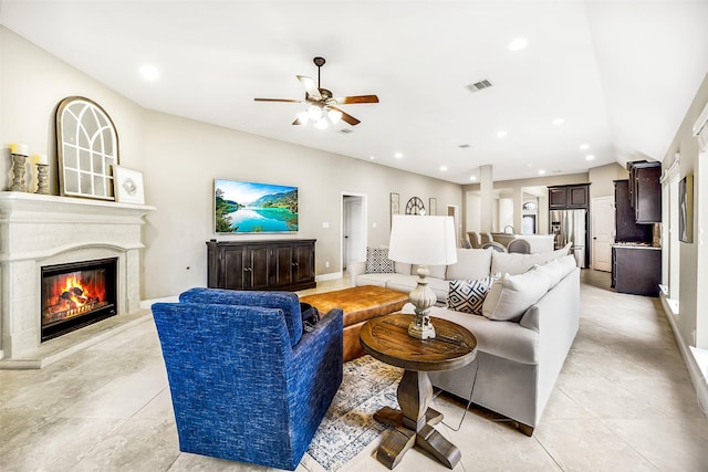 4011 Teramo Ln, Katy, TX 77493 - living area with a ceiling fan, a glass covered fireplace, baseboards, light tile patterned flooring, and recessed lighting