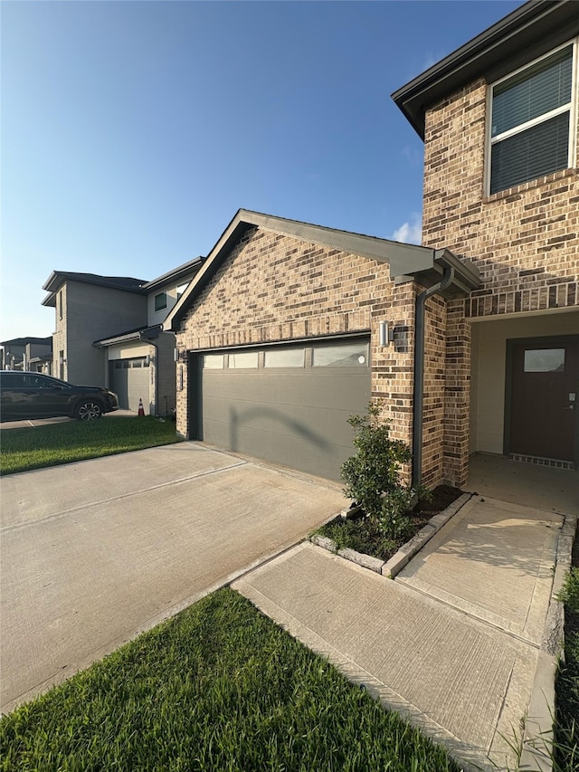 29506 Wilkerson Ln, Katy, TX 77494 - view of side of home with brick siding, a garage, and concrete driveway