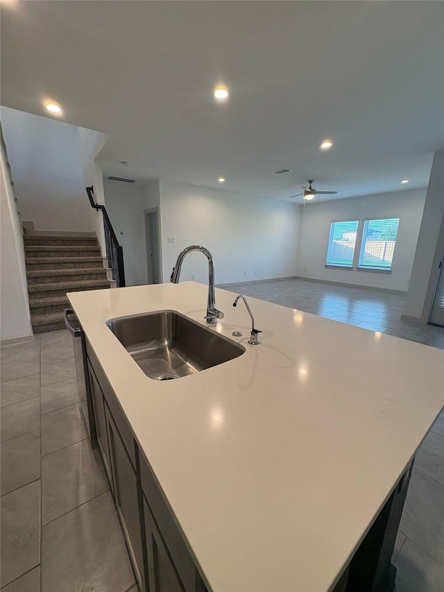 29506 Wilkerson Ln, Katy, TX 77494 - kitchen with a sink, a ceiling fan, open floor plan, a kitchen island with sink, and light countertops