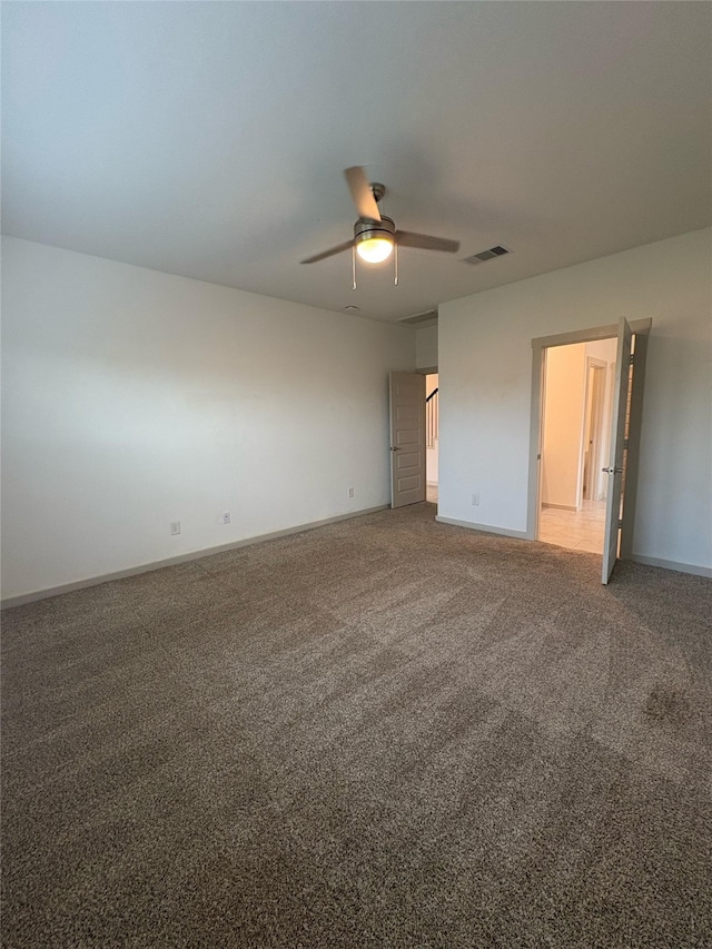 29506 Wilkerson Ln, Katy, TX 77494 - unfurnished bedroom featuring carpet, baseboards, and a ceiling fan