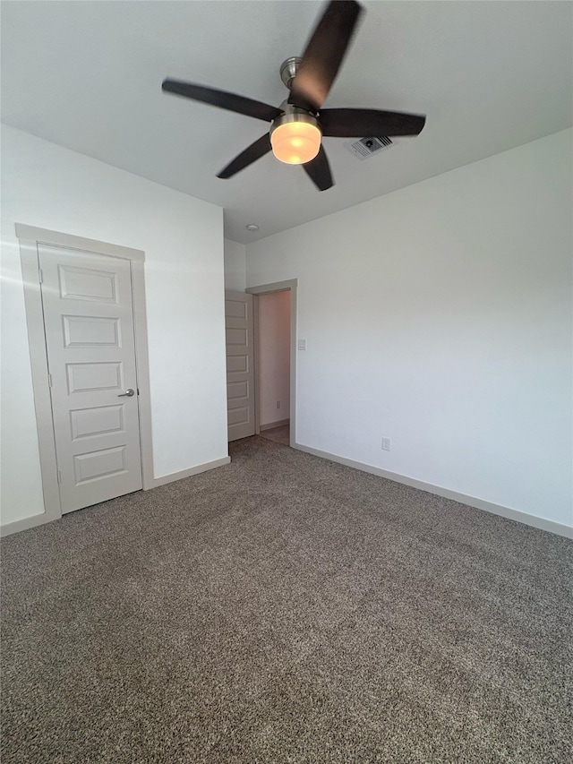 29506 Wilkerson Ln, Katy, TX 77494 - unfurnished bedroom with carpet floors, baseboards, and ceiling fan