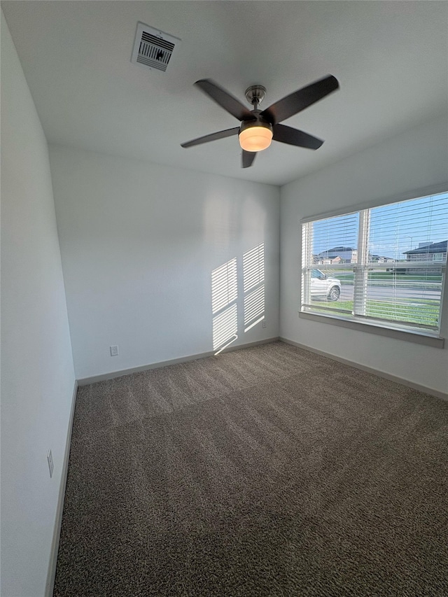 29506 Wilkerson Ln, Katy, TX 77494 - empty room with ceiling fan, carpet, and baseboards