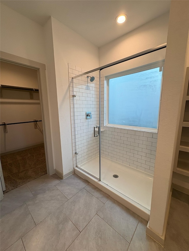 29506 Wilkerson Ln, Katy, TX 77494 - full bath featuring a walk in closet, a shower stall, and tile patterned floors