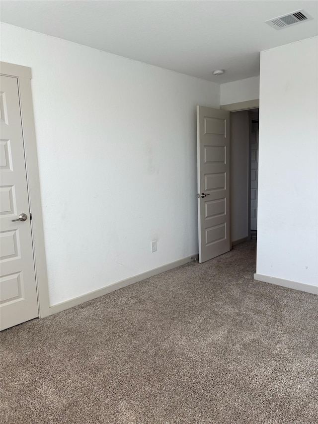 29506 Wilkerson Ln, Katy, TX 77494 - empty room featuring carpet flooring, baseboards, and a smoke detector