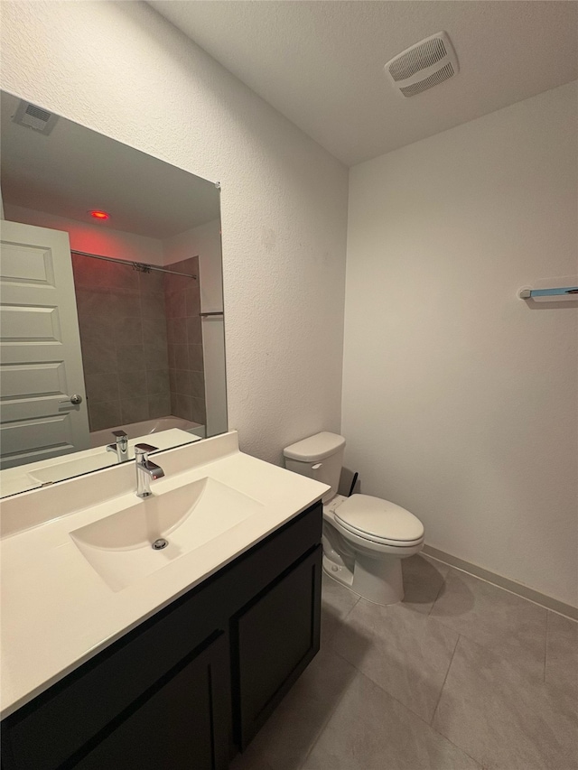29506 Wilkerson Ln, Katy, TX 77494 - full bathroom with vanity, toilet, tile patterned floors, and a shower