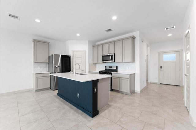 29506 Wilkerson Ln, Katy, TX 77494 - kitchen with appliances with stainless steel finishes, gray cabinets, backsplash, light countertops, and recessed lighting