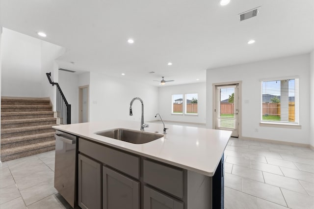 29506 Wilkerson Ln, Katy, TX 77494 - kitchen featuring gray cabinets, stainless steel dishwasher, an island with sink, recessed lighting, and light countertops