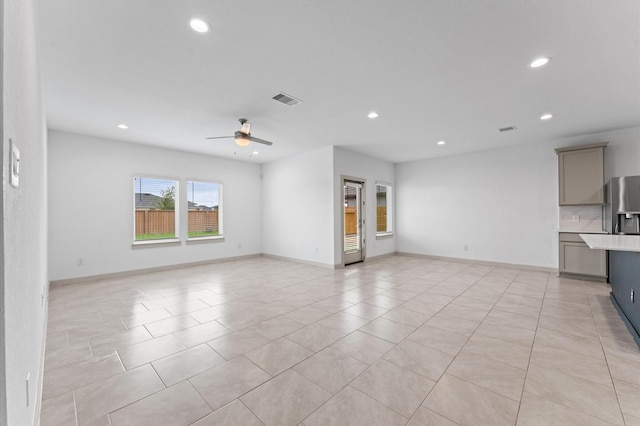 29506 Wilkerson Ln, Katy, TX 77494 - unfurnished living room with recessed lighting, a ceiling fan, and light tile patterned floors