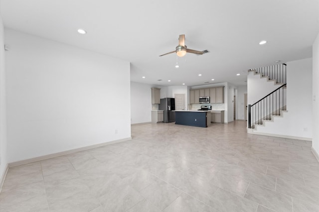 29506 Wilkerson Ln, Katy, TX 77494 - unfurnished living room featuring ceiling fan, recessed lighting, and stairway