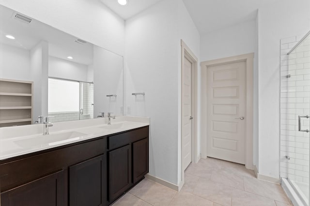 29506 Wilkerson Ln, Katy, TX 77494 - bathroom featuring a shower stall, double vanity, a closet, tile patterned floors, and recessed lighting