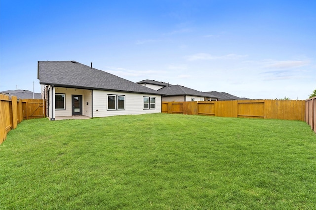 29506 Wilkerson Ln, Katy, TX 77494 - rear view of house with a fenced backyard and a shingled roof