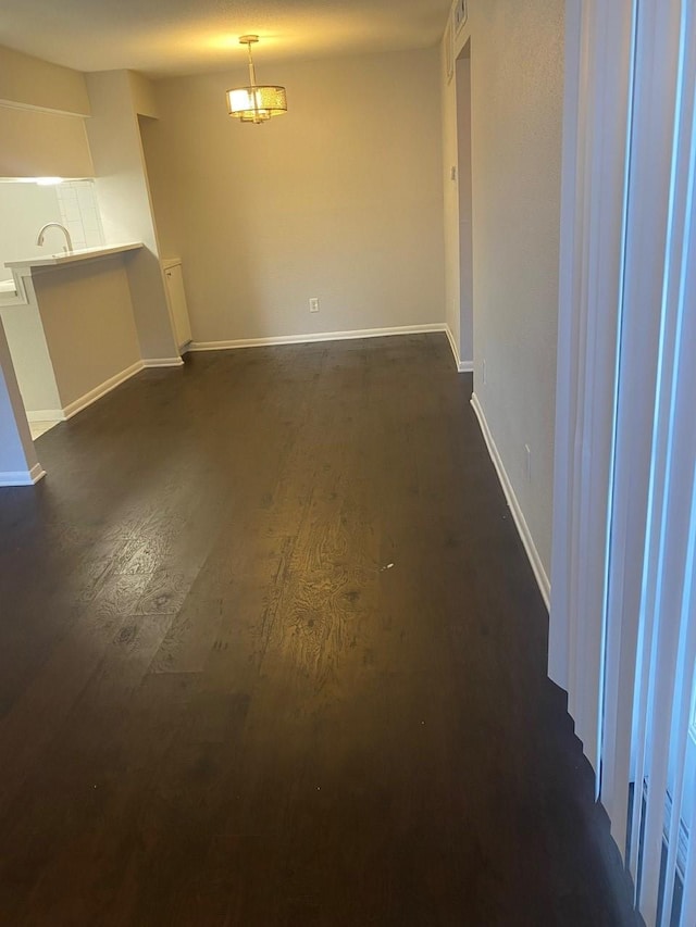 9000 Bissonnet St Unit 707, Houston, TX 77074 - unfurnished dining area with dark wood finished floors and baseboards