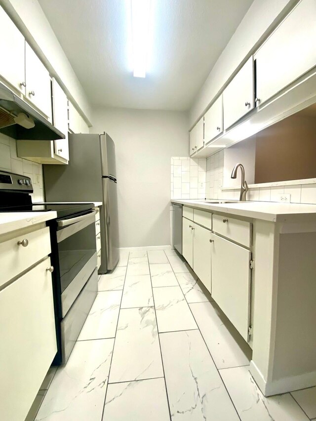 9000 Bissonnet St Unit 707, Houston, TX 77074 - kitchen with stainless steel appliances, light marble finish floors, under cabinet range hood, and light countertops