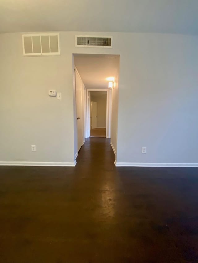 9000 Bissonnet St Unit 707, Houston, TX 77074 - unfurnished room with baseboards and dark wood-style flooring
