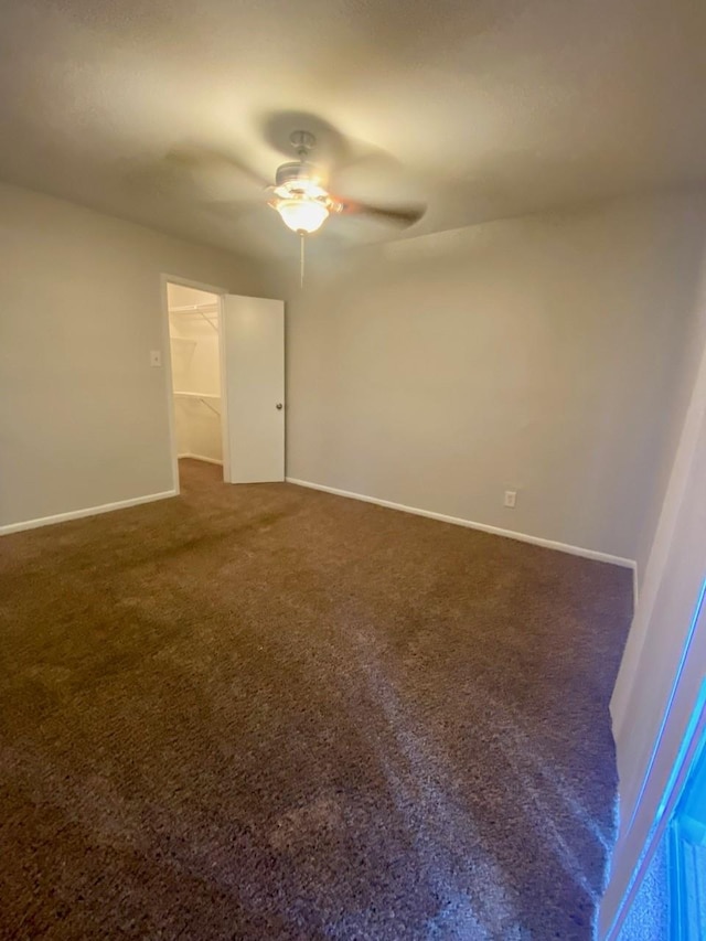 9000 Bissonnet St Unit 707, Houston, TX 77074 - carpeted spare room featuring a ceiling fan and baseboards