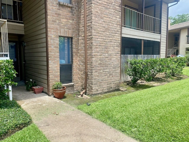 9000 Bissonnet St Unit 707, Houston, TX 77074 - property entrance featuring brick siding and a yard