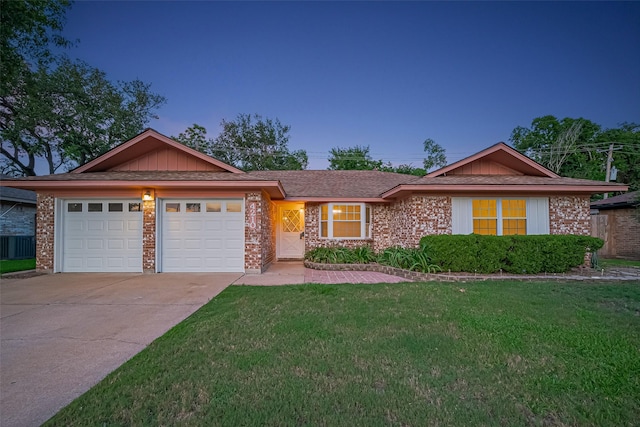 4210 Mona Lee Ln, Houston, TX 77080 - view of front of property with a garage, driveway, a front lawn, and brick siding