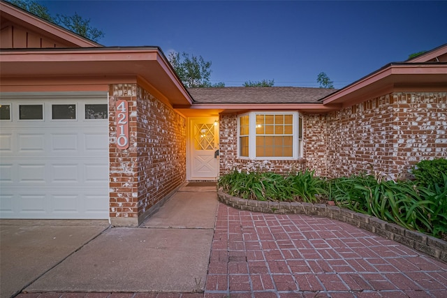 4210 Mona Lee Ln, Houston, TX 77080 - entrance to property with brick siding, board and batten siding, an attached garage, and a shingled roof