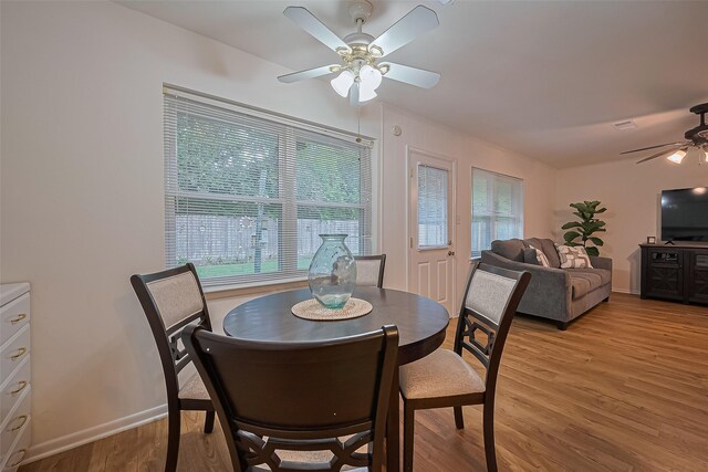 4210 Mona Lee Ln, Houston, TX 77080 - dining room featuring a ceiling fan, light wood-type flooring, healthy amount of natural light, and baseboards