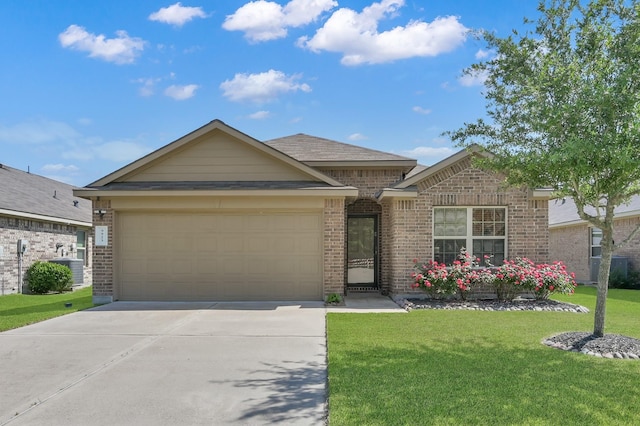 9923 Berlandier Ash Ln, Tomball, TX 77375 - view of front of property featuring brick siding, a garage, a front yard, and concrete driveway