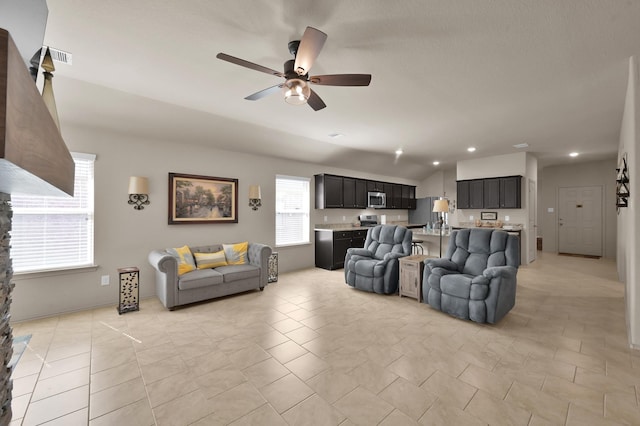 9923 Berlandier Ash Ln, Tomball, TX 77375 - living area featuring ceiling fan, vaulted ceiling, and recessed lighting
