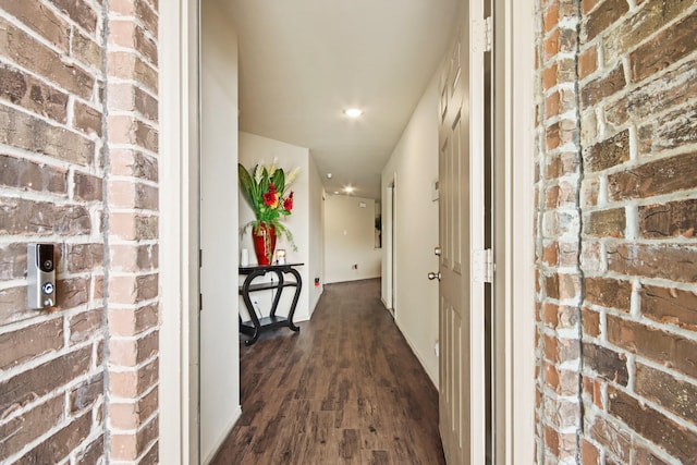 24402 Yellow Thyme Dr, Spring, TX 77373 - corridor with dark wood-style floors, recessed lighting, and brick wall