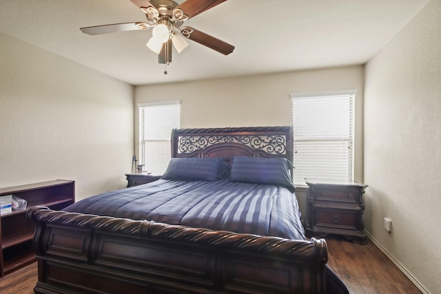 24402 Yellow Thyme Dr, Spring, TX 77373 - bedroom with dark wood-type flooring, baseboards, a textured wall, and a ceiling fan