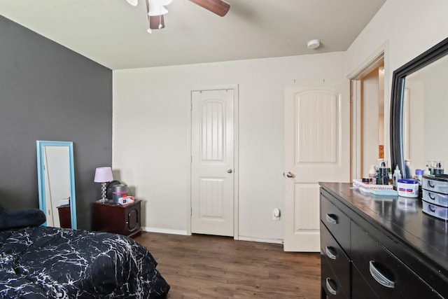 24402 Yellow Thyme Dr, Spring, TX 77373 - bedroom featuring dark wood-style flooring, ceiling fan, and baseboards