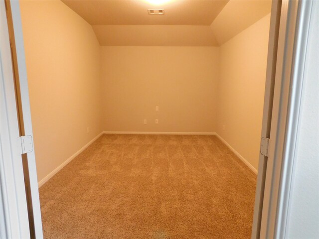 14827 Fairy Tern Ln, Houston, TX 77049 - empty room with light carpet, vaulted ceiling, and baseboards