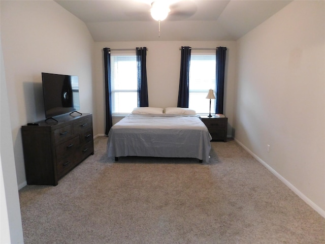 14827 Fairy Tern Ln, Houston, TX 77049 - bedroom featuring lofted ceiling, light carpet, baseboards, and a ceiling fan