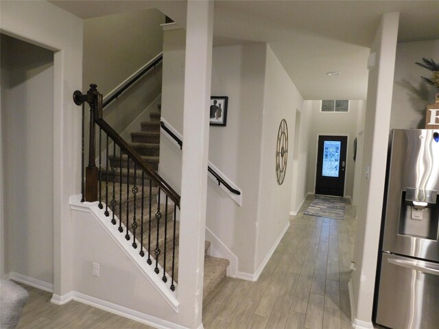 14827 Fairy Tern Ln, Houston, TX 77049 - foyer entrance featuring wood finished floors, baseboards, and stairway