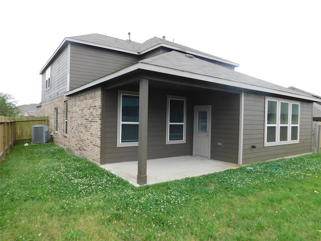14827 Fairy Tern Ln, Houston, TX 77049 - rear view of property featuring brick siding, a patio area, and cooling unit