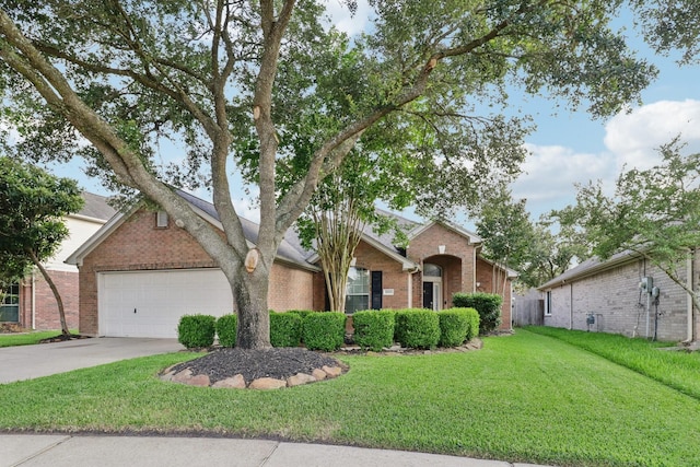 5023 Rocky Manor Ln, Katy, TX 77449 - view of front facade featuring brick siding, an attached garage, driveway, and a front yard