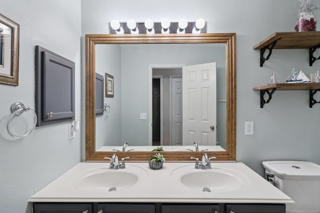 5023 Rocky Manor Ln, Katy, TX 77449 - bathroom featuring toilet and double vanity
