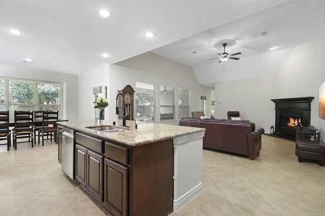 266 Overland Trce, Montgomery, TX 77316 - kitchen featuring a sink, stainless steel dishwasher, dark brown cabinetry, light tile patterned floors, and lofted ceiling