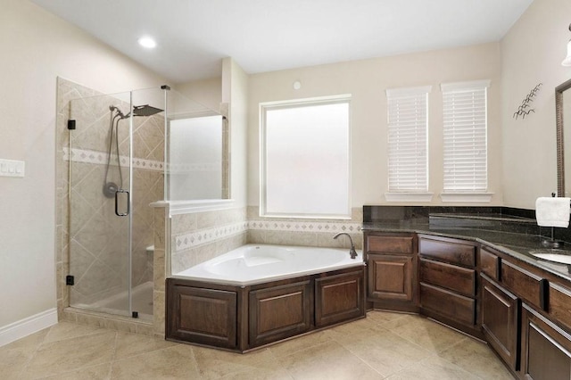 266 Overland Trce, Montgomery, TX 77316 - full bathroom featuring a bath, a stall shower, tile patterned flooring, and vanity