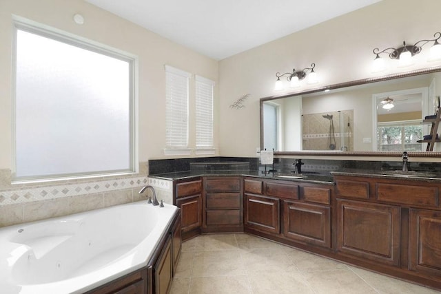266 Overland Trce, Montgomery, TX 77316 - bathroom with a stall shower, a tub with jets, double vanity, tile patterned flooring, and a ceiling fan