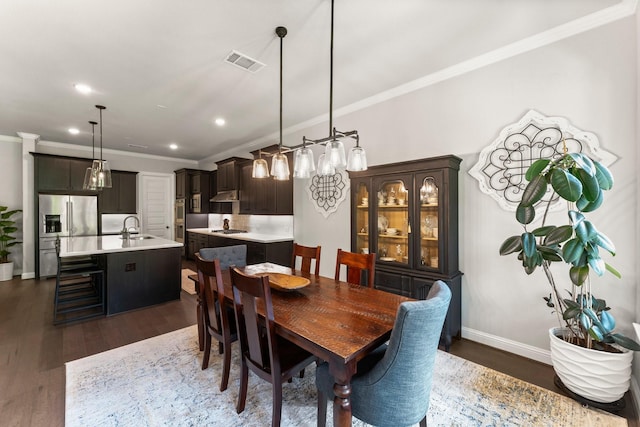 5595 Fallen Antler Dr, Spring, TX 77386 - dining area with crown molding, dark wood-type flooring, recessed lighting, and baseboards