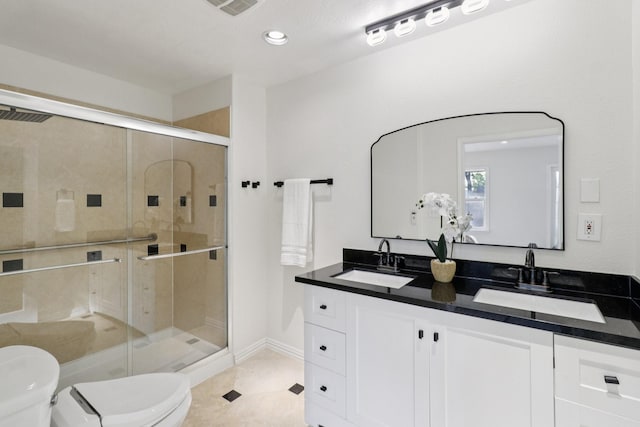 10328 Shadow Oaks Dr, Houston, TX 77043 - full bath with toilet, double vanity, a stall shower, recessed lighting, and baseboards