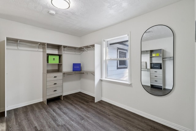 10328 Shadow Oaks Dr, Houston, TX 77043 - walk in closet with dark wood-style floors