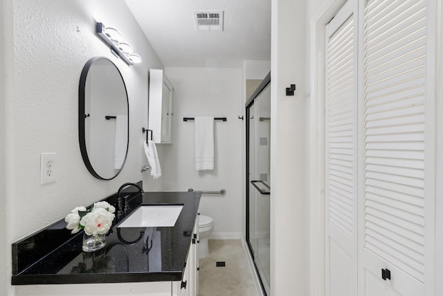 10328 Shadow Oaks Dr, Houston, TX 77043 - full bathroom featuring a closet, toilet, a stall shower, vanity, and baseboards