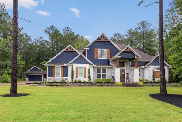 19817 Whispering Creek Trl, Magnolia, TX 77355 - craftsman house with a front yard, an outbuilding, a detached garage, and brick siding