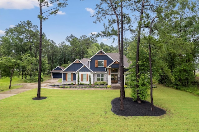 19817 Whispering Creek Trl, Magnolia, TX 77355 - craftsman inspired home with concrete driveway, board and batten siding, and a front lawn