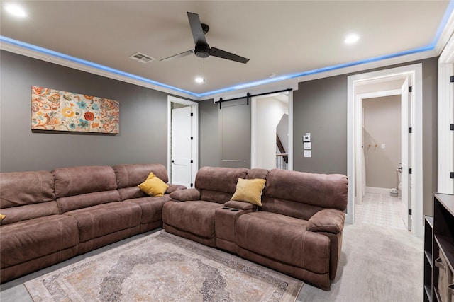 19817 Whispering Creek Trl, Magnolia, TX 77355 - cinema room with ceiling fan, a barn door, crown molding, recessed lighting, and light carpet