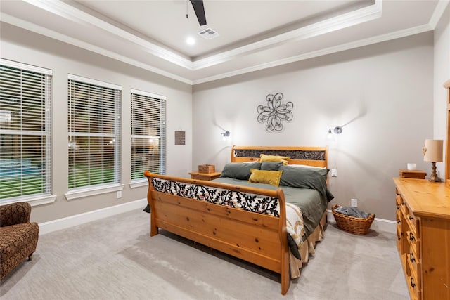 19817 Whispering Creek Trl, Magnolia, TX 77355 - bedroom featuring a raised ceiling, ornamental molding, light carpet, baseboards, and a ceiling fan