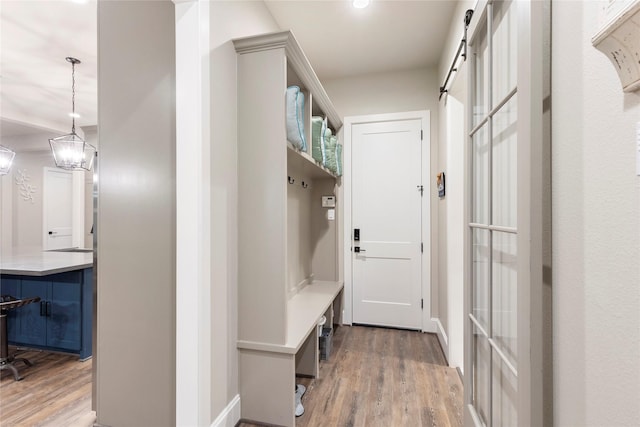 19817 Whispering Creek Trl, Magnolia, TX 77355 - mudroom featuring wood finished floors and baseboards