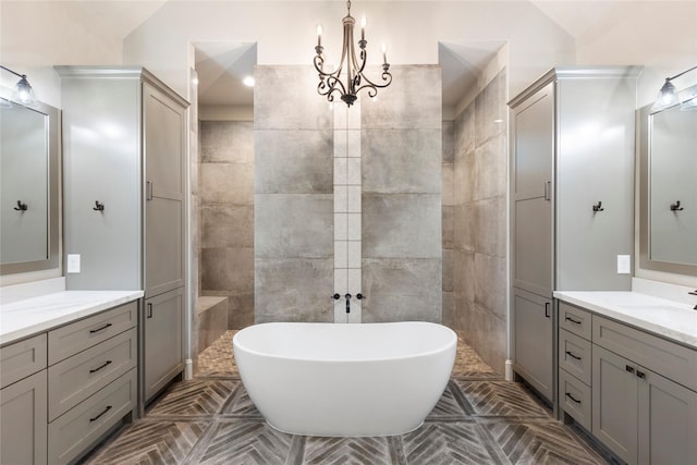 19817 Whispering Creek Trl, Magnolia, TX 77355 - bathroom with a soaking tub, two vanities, and tile walls