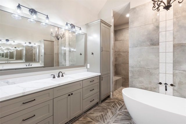 19817 Whispering Creek Trl, Magnolia, TX 77355 - bathroom with a freestanding bath, vanity, and a chandelier