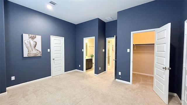 3021 Rocky Point Dr, Pearland, TX 77584 - unfurnished bedroom featuring light colored carpet, a walk in closet, baseboards, and a closet