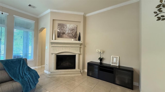 3021 Rocky Point Dr, Pearland, TX 77584 - living room featuring crown molding, light tile patterned floors, a fireplace, baseboards, and arched walkways